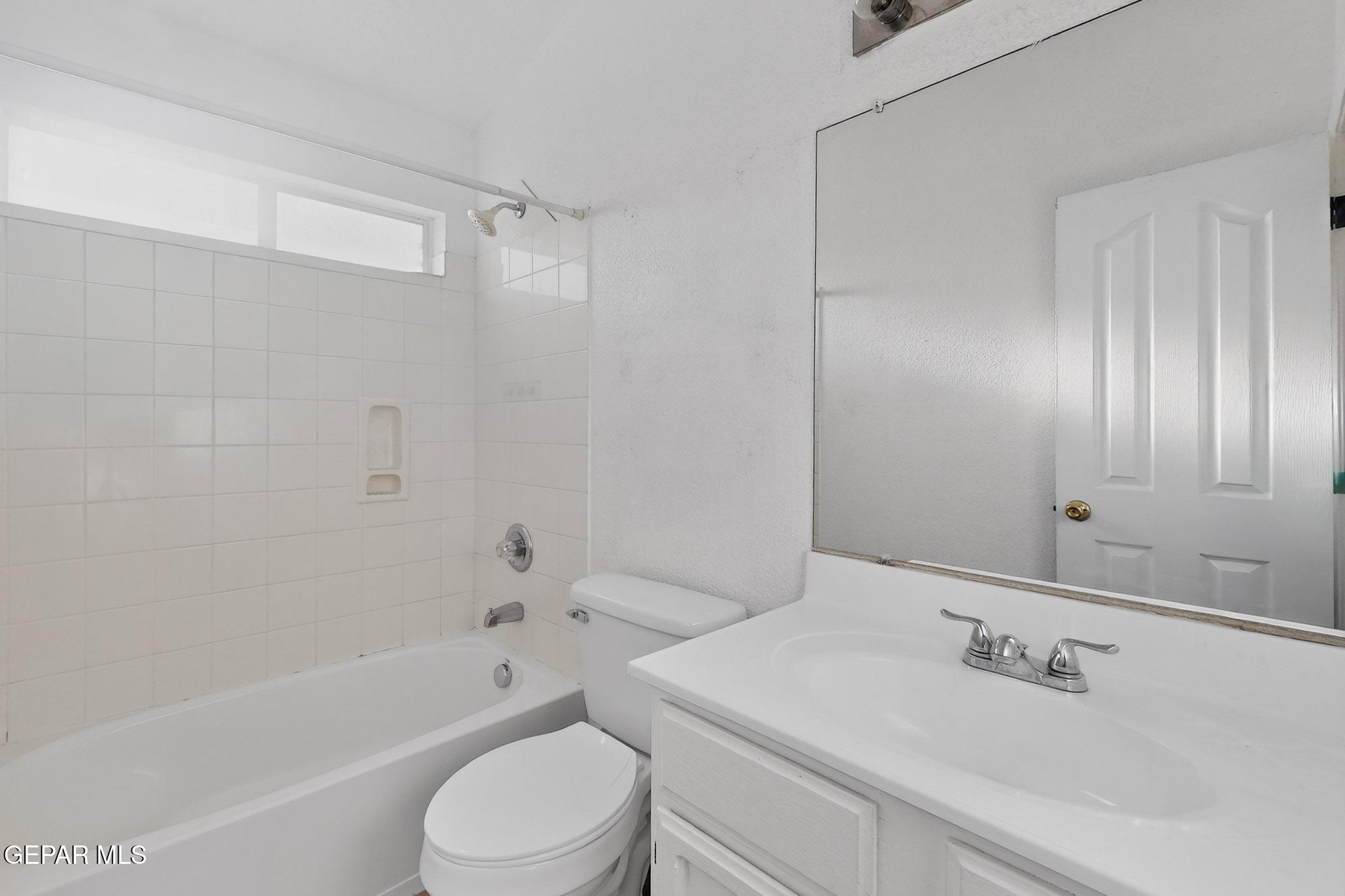 3626 Dominican Street El Paso, TX 79936 - Photo 16 of 20 a bathroom with a sink toilet and shower