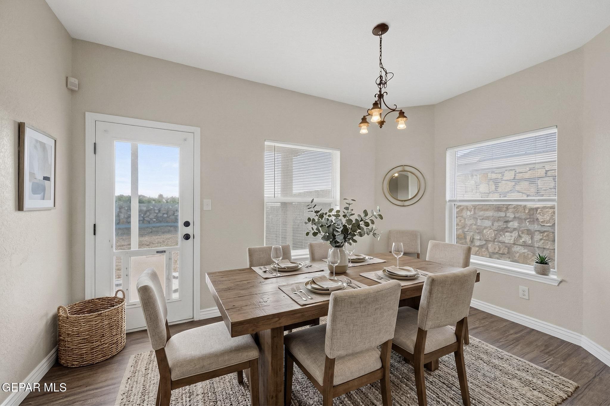 3626 Dominican Street El Paso, TX 79936 - Photo 10 of 20 a view of a dining room with furniture window and wooden floor