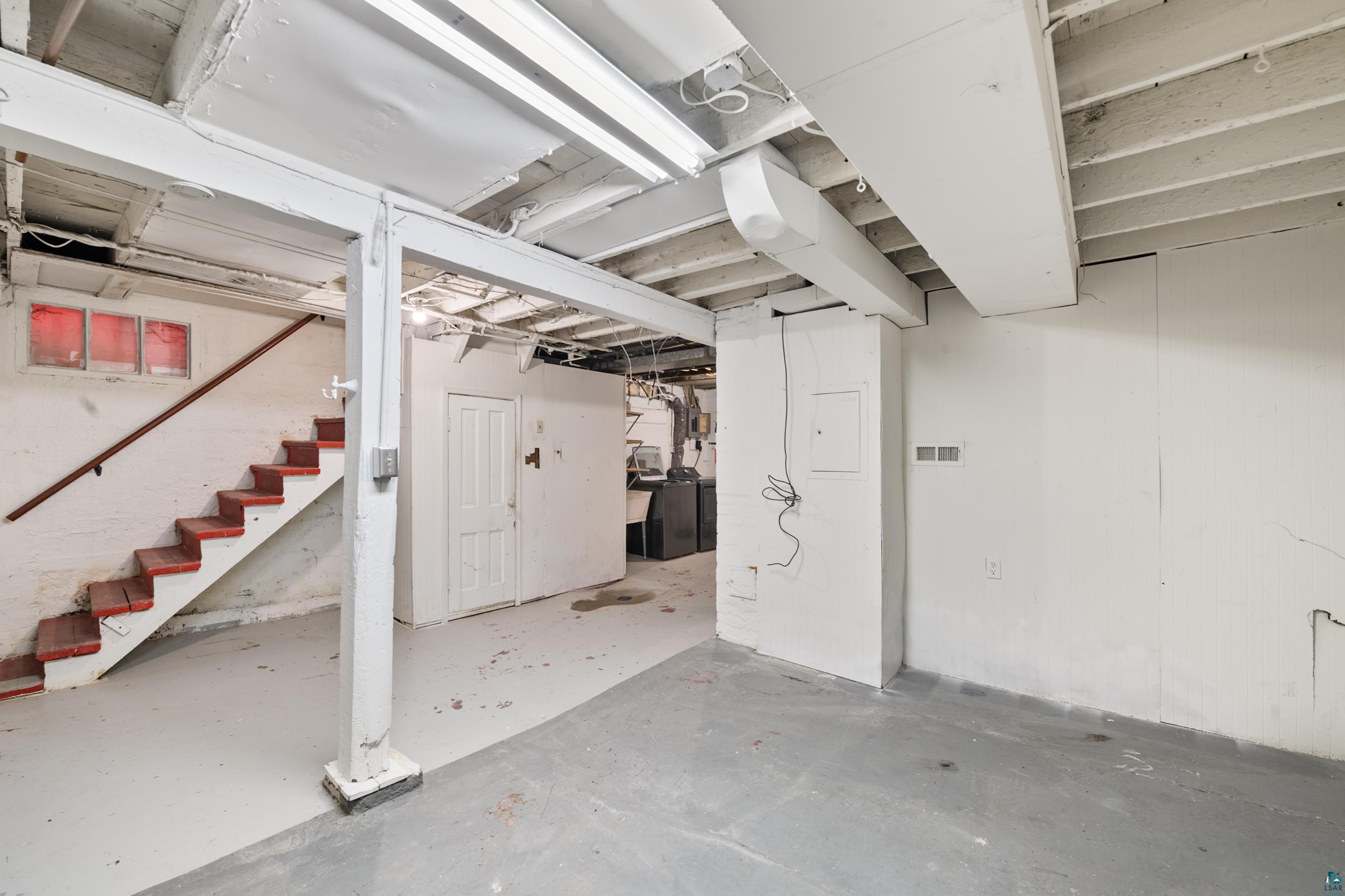3067 Restormel Street Duluth, MN 55806 - Photo 17 of 25 Spacious unfinished basement with concrete flooring and white-painted walls