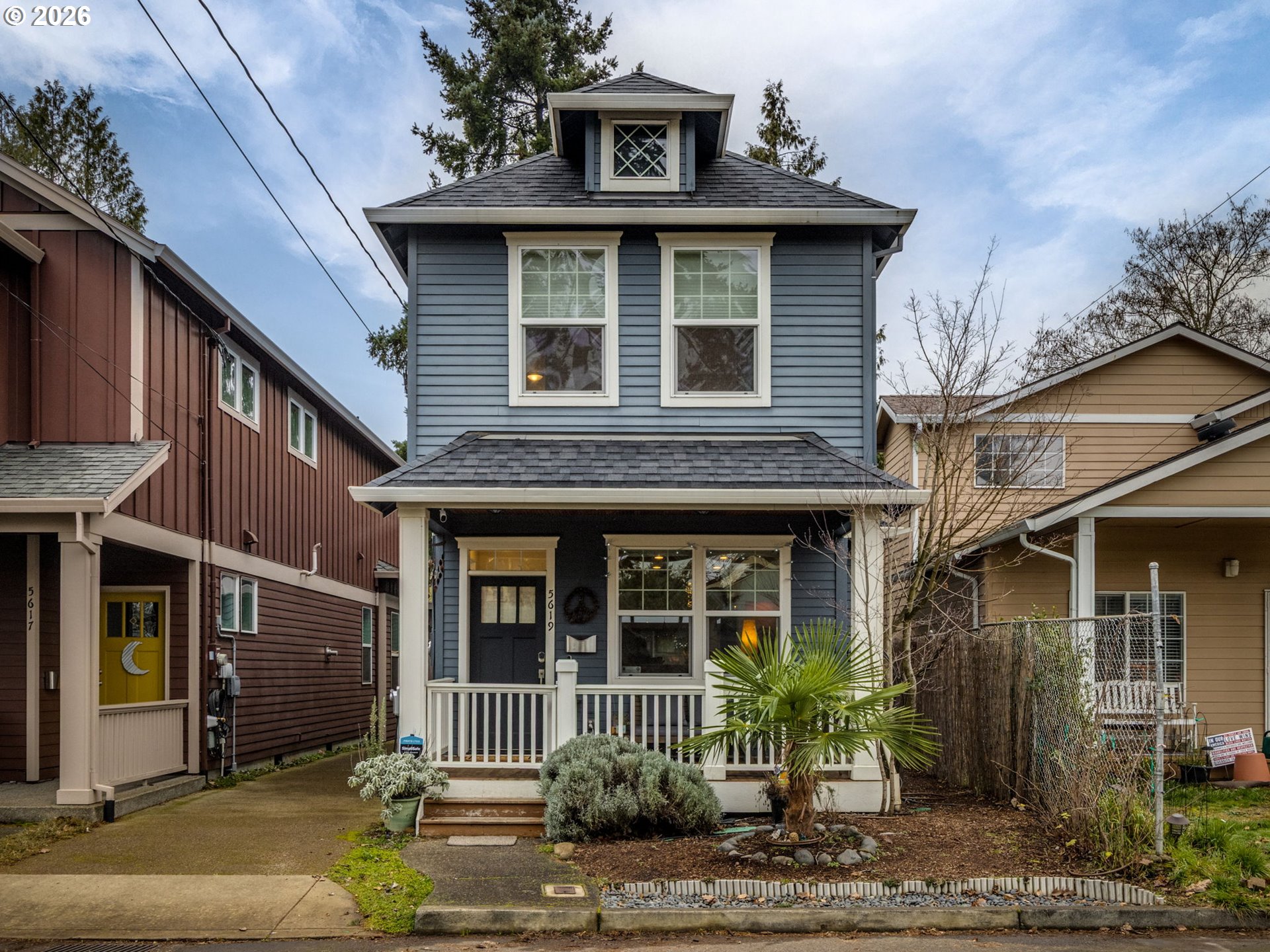 5619 Southeast Carlton Street Portland, OR 97206 - Photo 1 of 30 a front view of a house with garden