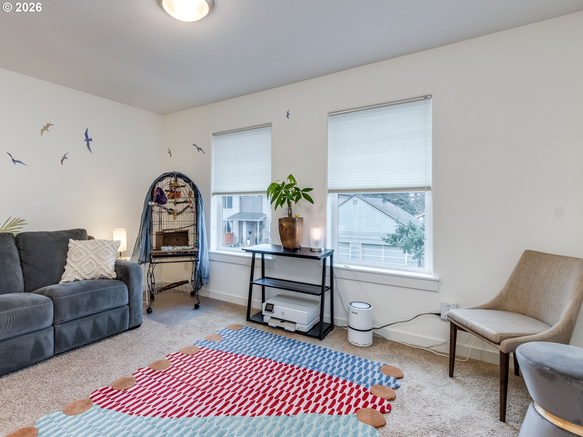 5619 Southeast Carlton Street Portland, OR 97206 - Photo 12 of 30 a living room with furniture a rug and a window
