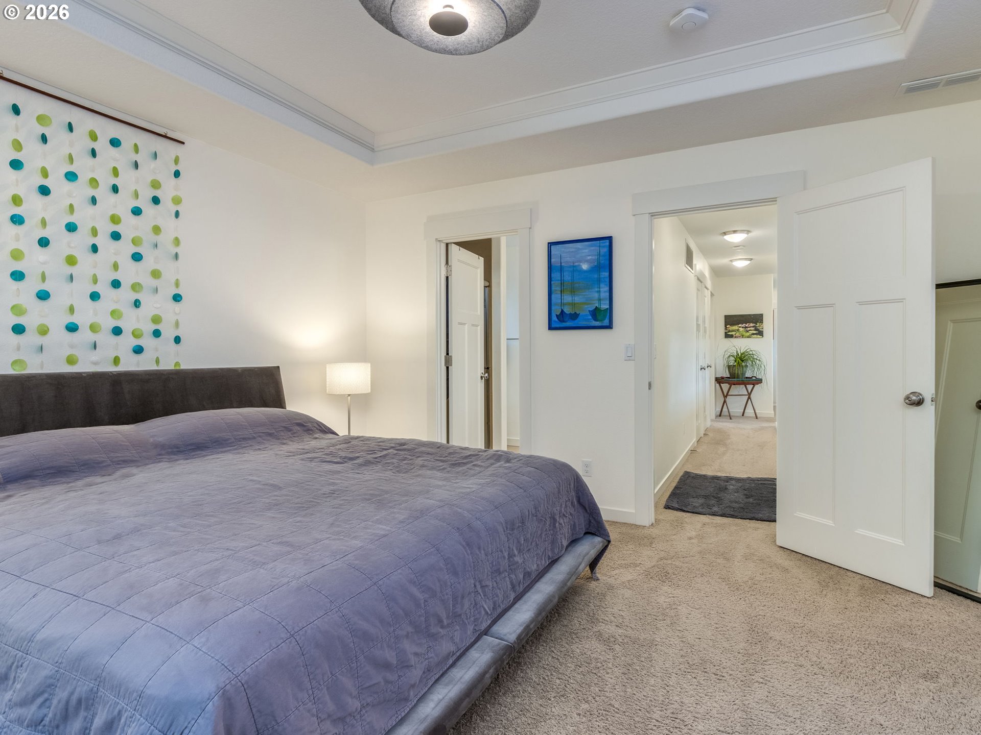 5619 Southeast Carlton Street Portland, OR 97206 - Photo 16 of 30 a bedroom with a bed and a view of bathroom