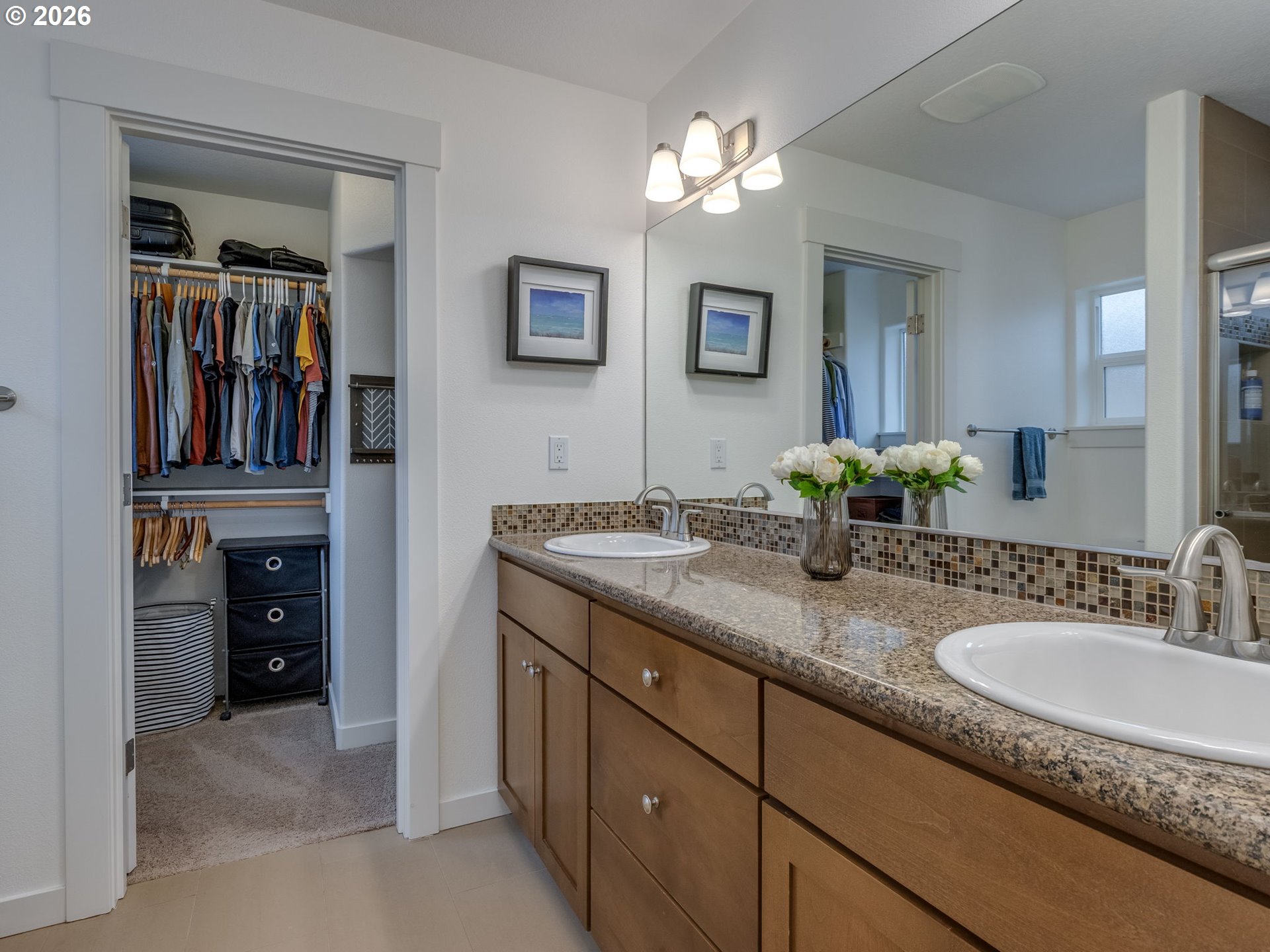 5619 Southeast Carlton Street Portland, OR 97206 - Photo 17 of 30 a bathroom with a sink double vanity and a mirror