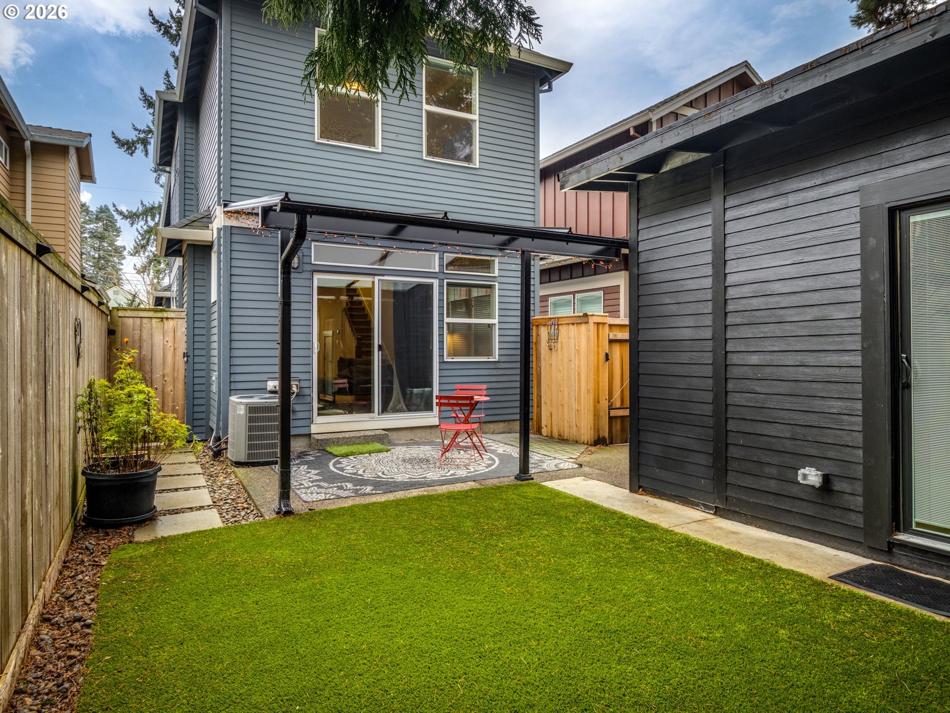 5619 Southeast Carlton Street Portland, OR 97206 - Photo 21 of 30 a view of a house with porch and garden