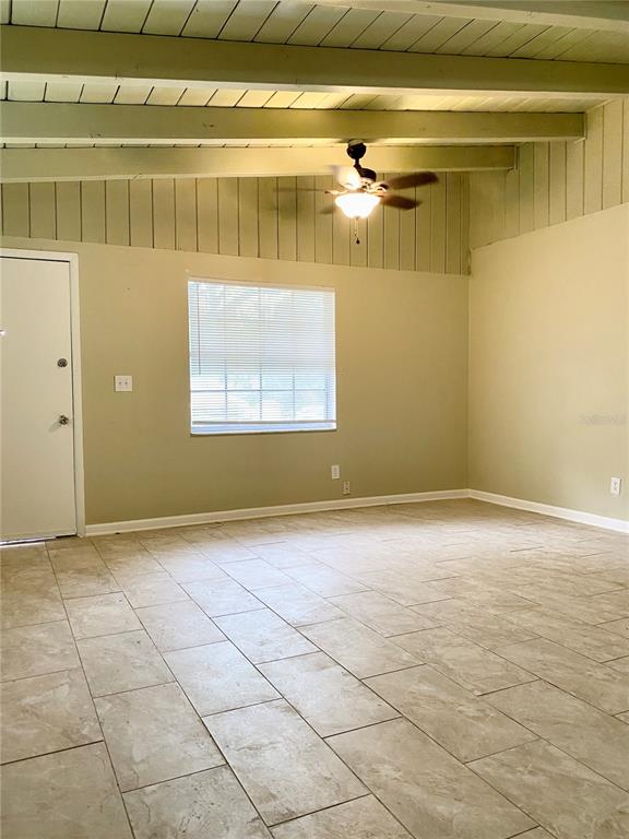 913 East 123rd Avenue, Unit A Tampa, FL 33612 - Photo 5 of 8 a view of an empty room with a window