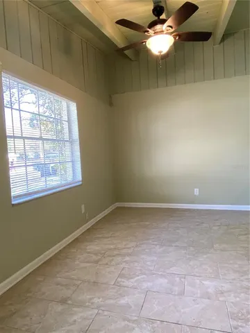 a view of an empty room with a window