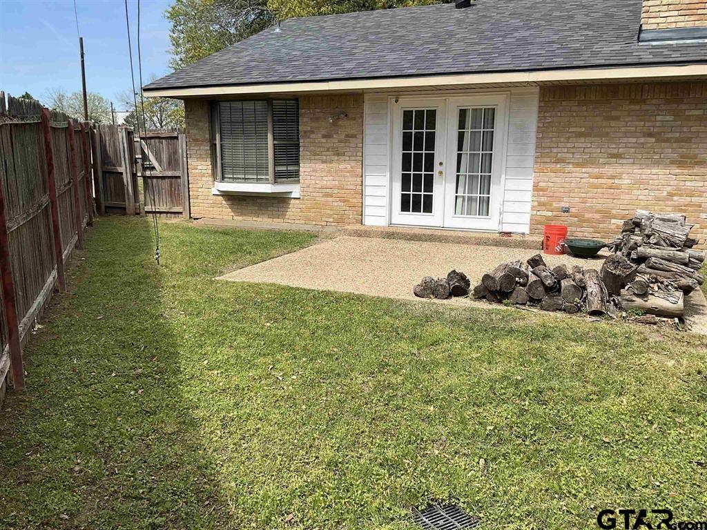 5101 Foxglove Circle Tyler, TX 75703 - Photo 11 of 12 a front view of a house with garden