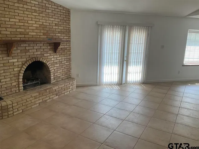 a view of an empty room with windows