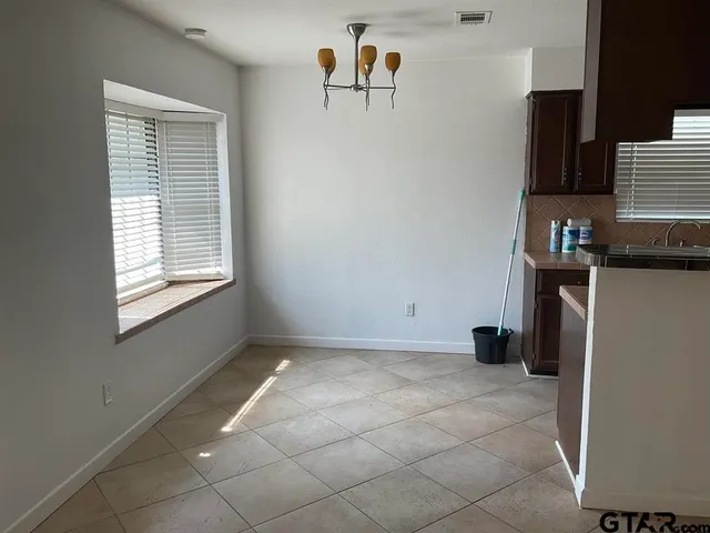 a view of kitchen with furniture and window