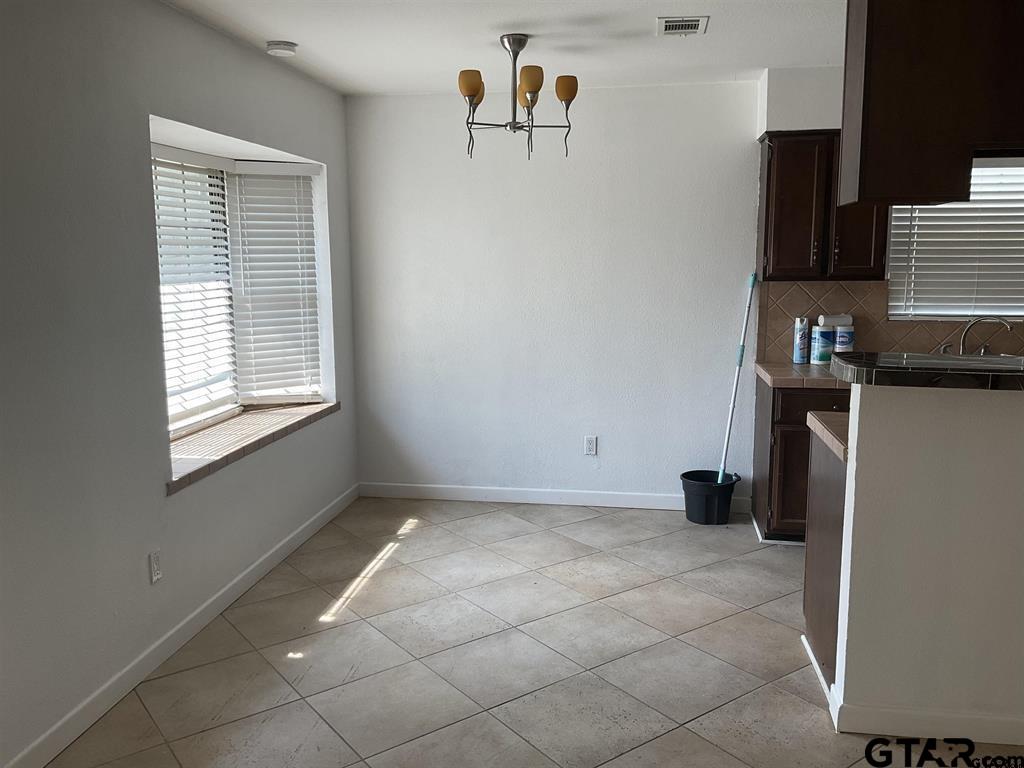 5101 Foxglove Circle Tyler, TX 75703 - Photo 5 of 12 a view of kitchen with furniture and window