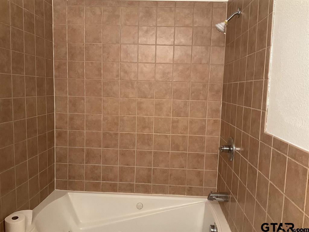 5101 Foxglove Circle Tyler, TX 75703 - Photo 9 of 12 a bathroom with a bathtub