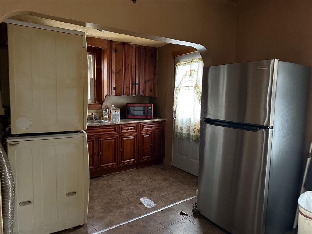 73-75 Draper Avenue Mansfield, MA 02048 - Photo 16 of 21 a kitchen with stainless steel appliances a refrigerator and a sink