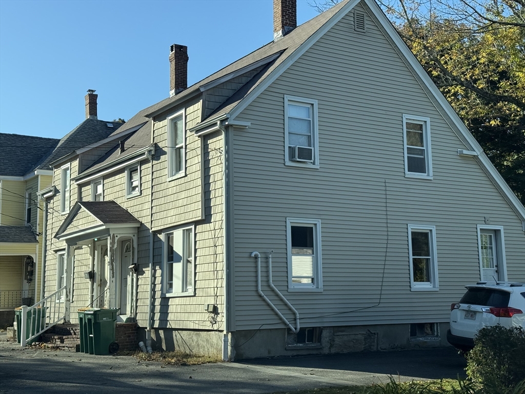 73-75 Draper Avenue Mansfield, MA 02048 - Photo 2 of 21 a view of a house with a yard