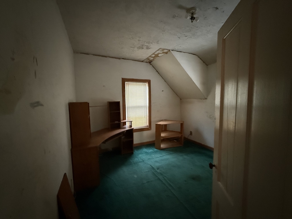 73-75 Draper Avenue Mansfield, MA 02048 - Photo 21 of 21 a living room with furniture and a gate