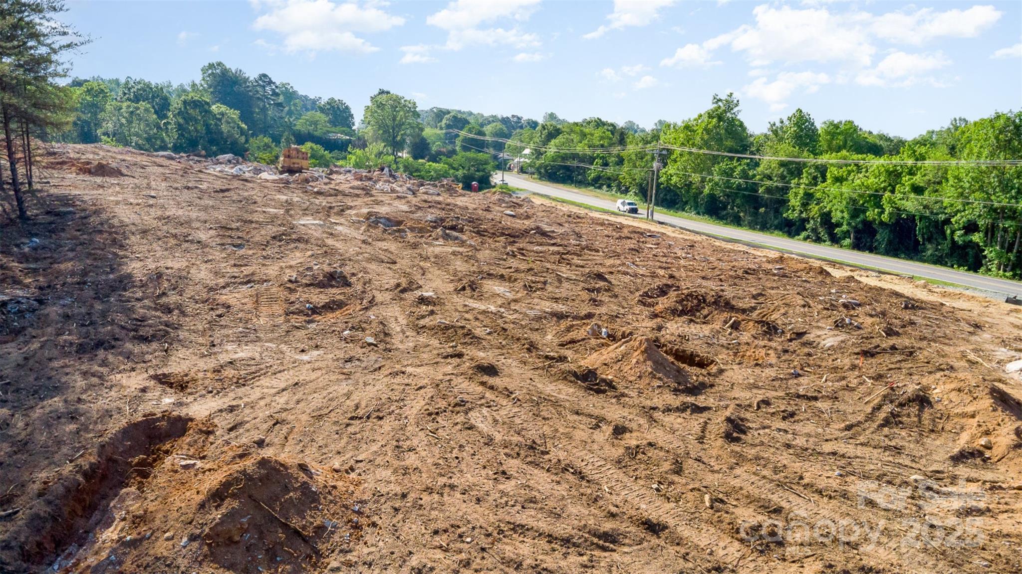 0 Pump Station Road Kannapolis, NC 28081 - Photo 3 of 14 a view of a dry yard with trees in the background