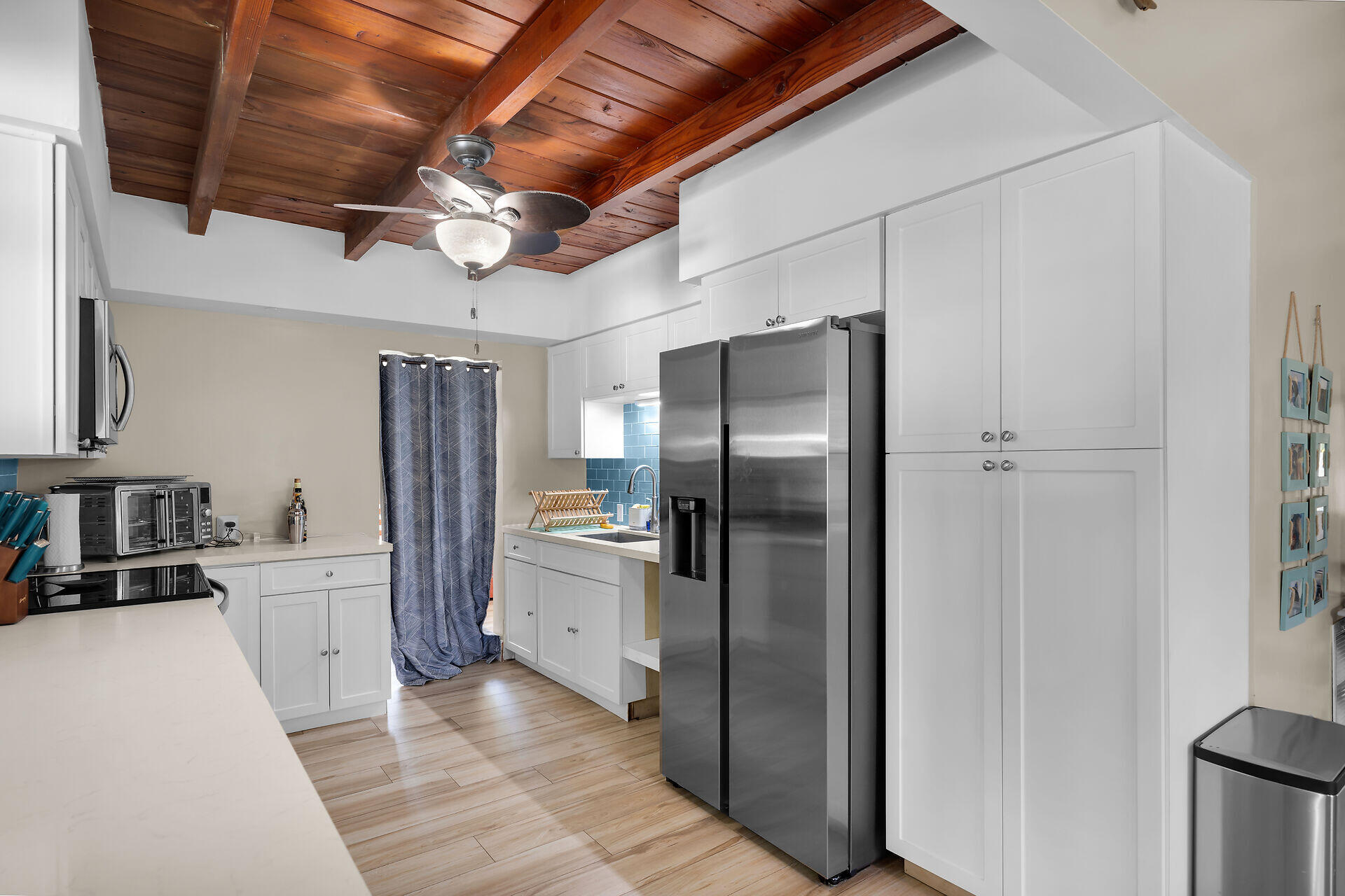 28 Tarpon Avenue Key Largo, FL 33037 - Photo 19 of 42 a kitchen with stainless steel appliances a refrigerator and a stove top oven