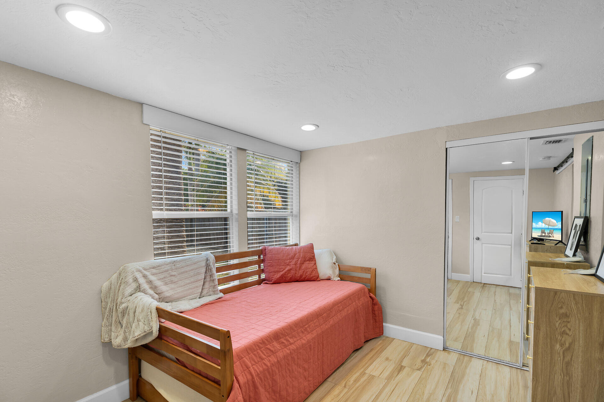 28 Tarpon Avenue Key Largo, FL 33037 - Photo 21 of 42 a bedroom with a bed and wooden floor