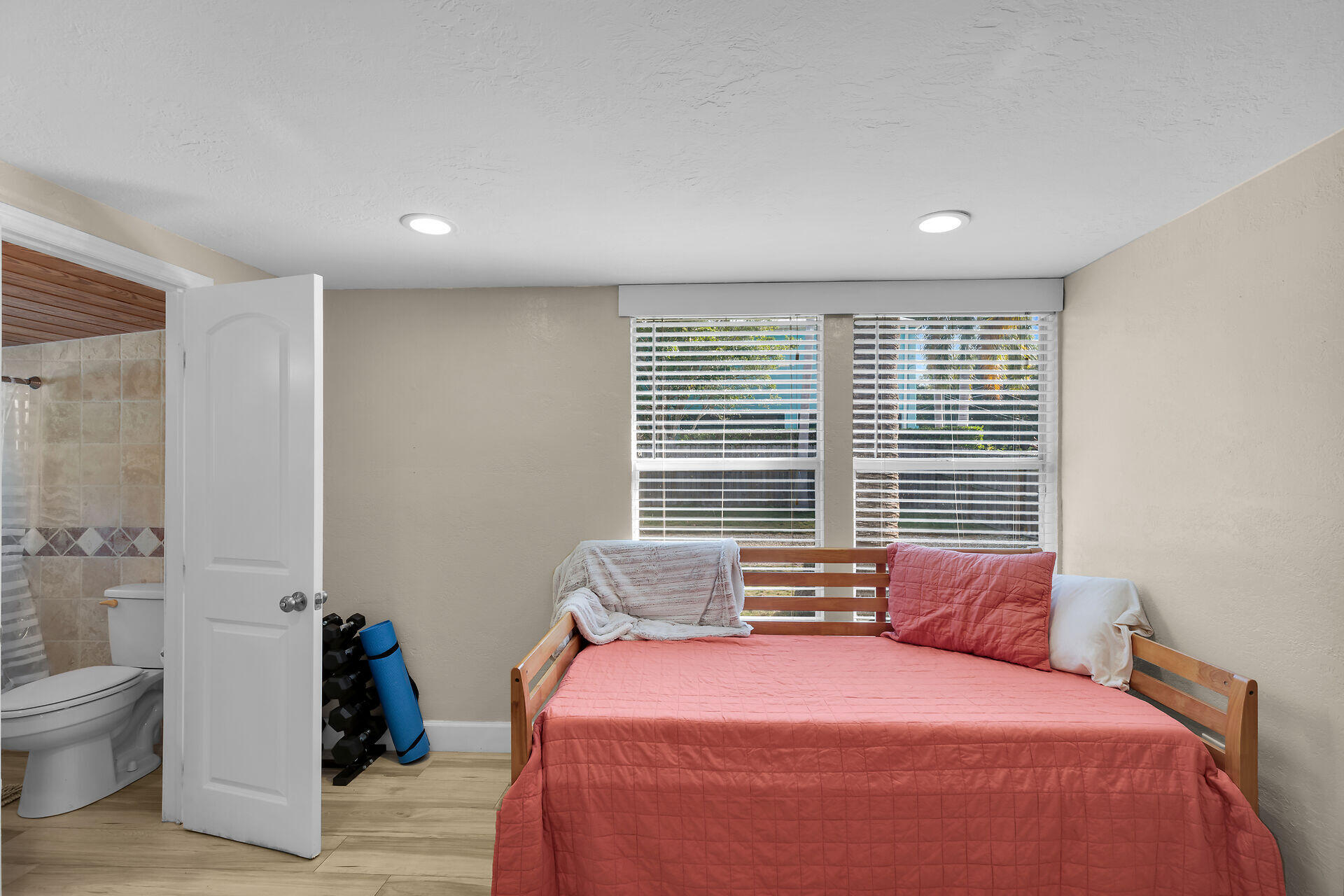28 Tarpon Avenue Key Largo, FL 33037 - Photo 22 of 42 a bedroom with a bed and wooden floor