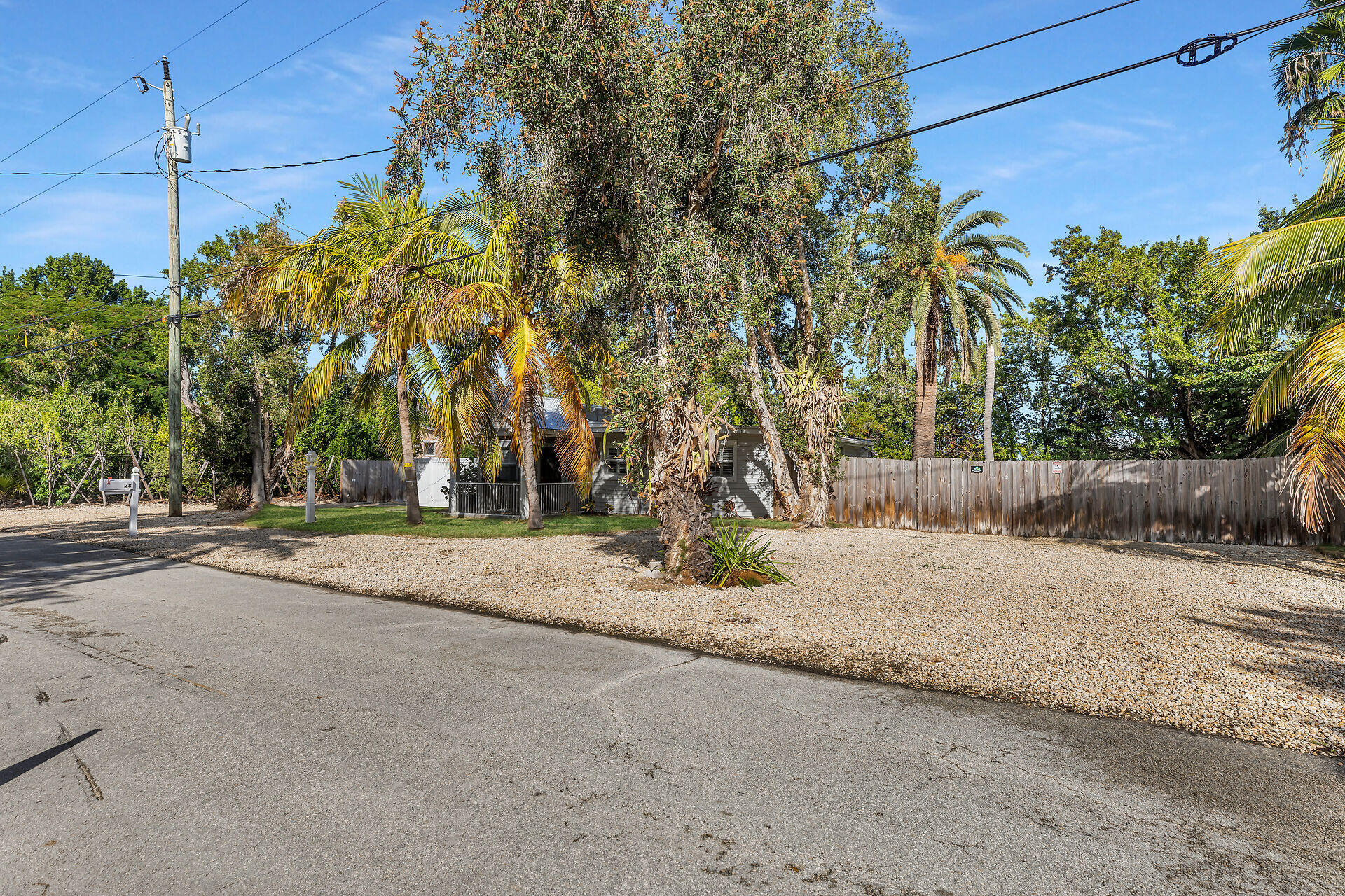 28 Tarpon Avenue Key Largo, FL 33037 - Photo 36 of 42 a view of a road with a house in the background