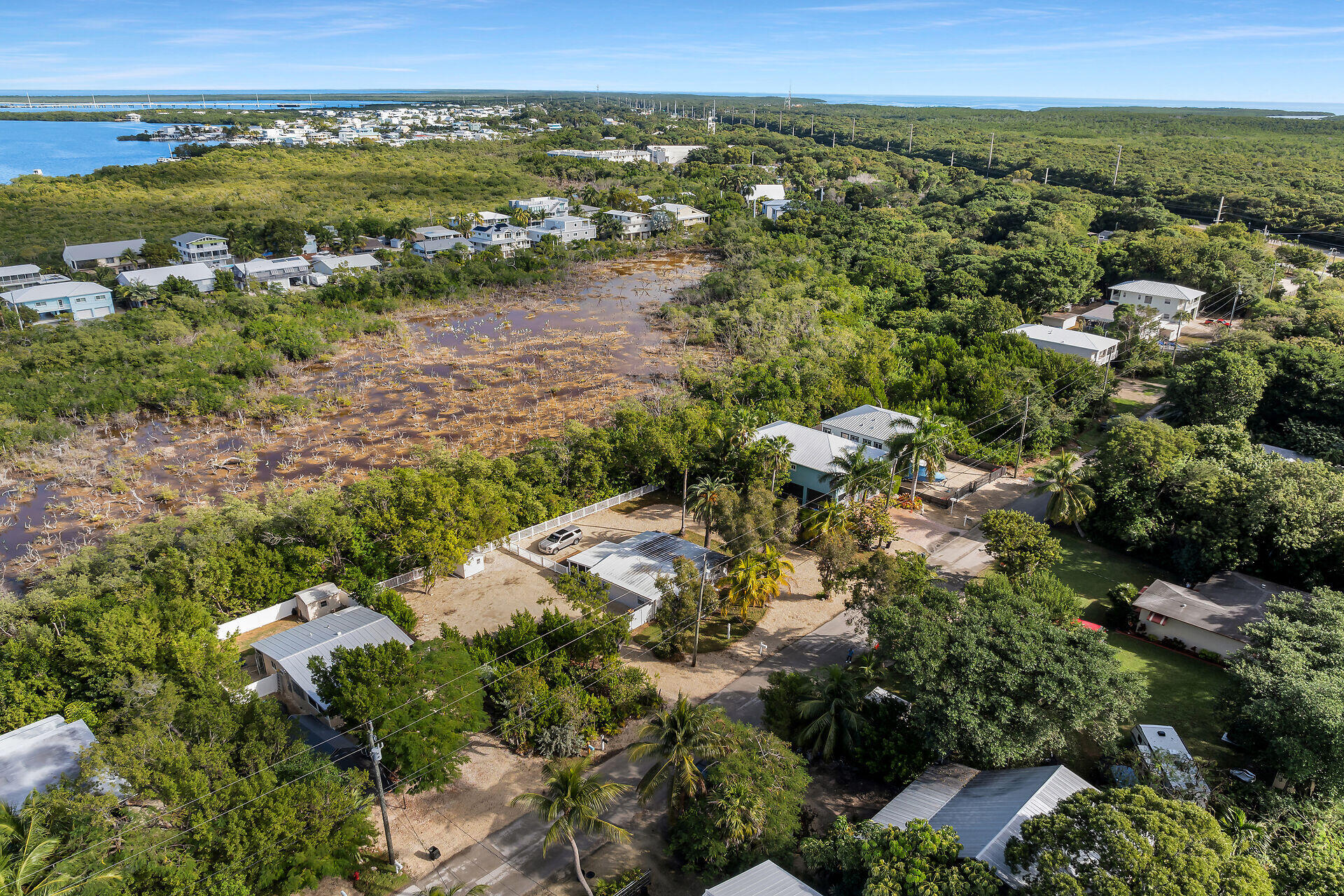 28 Tarpon Avenue Key Largo, FL 33037 - Photo 42 of 42 an aerial view of residential houses with outdoor space and trees