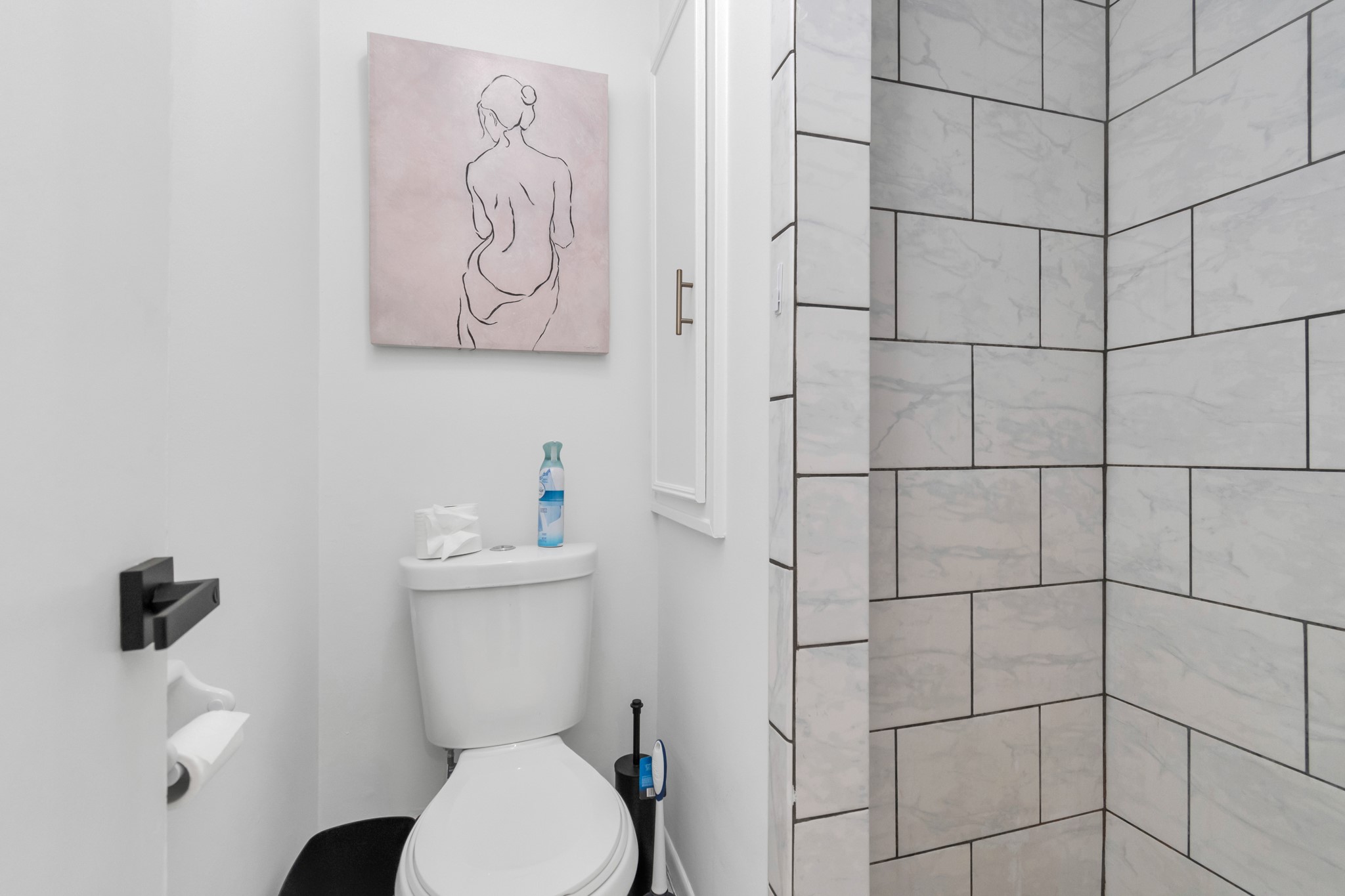 2718 Lazy Spring Drive Houston, TX 77080 - Photo 16 of 32 Clean, modern bathroom with a tiled shower and simple, updated finishes.