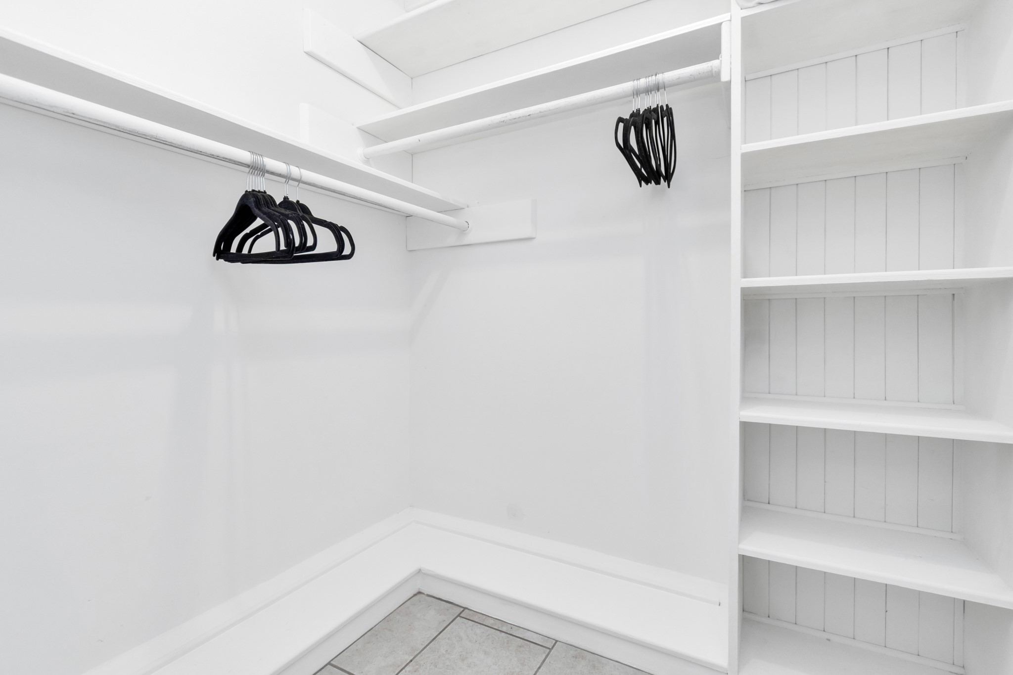 2718 Lazy Spring Drive Houston, TX 77080 - Photo 18 of 32 Spacious walk-in closet with built-in white shelving and hanging space. Plenty of room for organized storage.