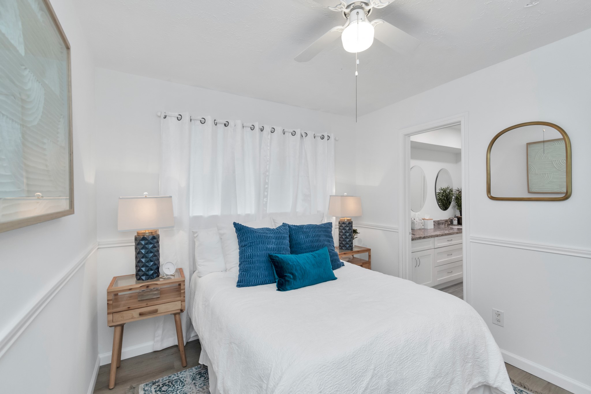 2718 Lazy Spring Drive Houston, TX 77080 - Photo 19 of 32 Comfortable secondary bedroom with great natural light and white oak-look LVP flooring. Bright and versatile space for guests, secondary bedroom or a home office.