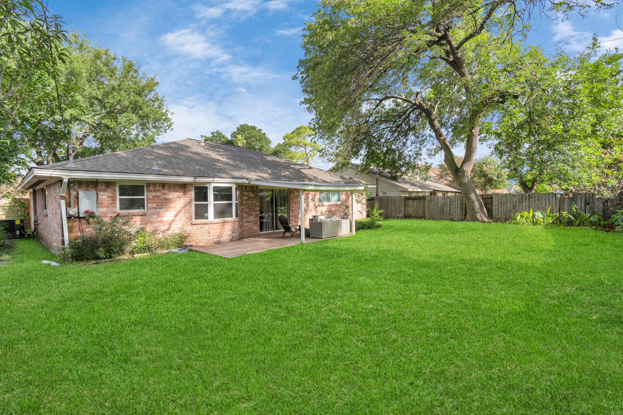 2718 Lazy Spring Drive Houston, TX 77080 - Photo 29 of 32 Large, fully fenced backyard with mature trees and plenty of space to play, relax, or entertain. Private and shaded for year-round enjoyment.