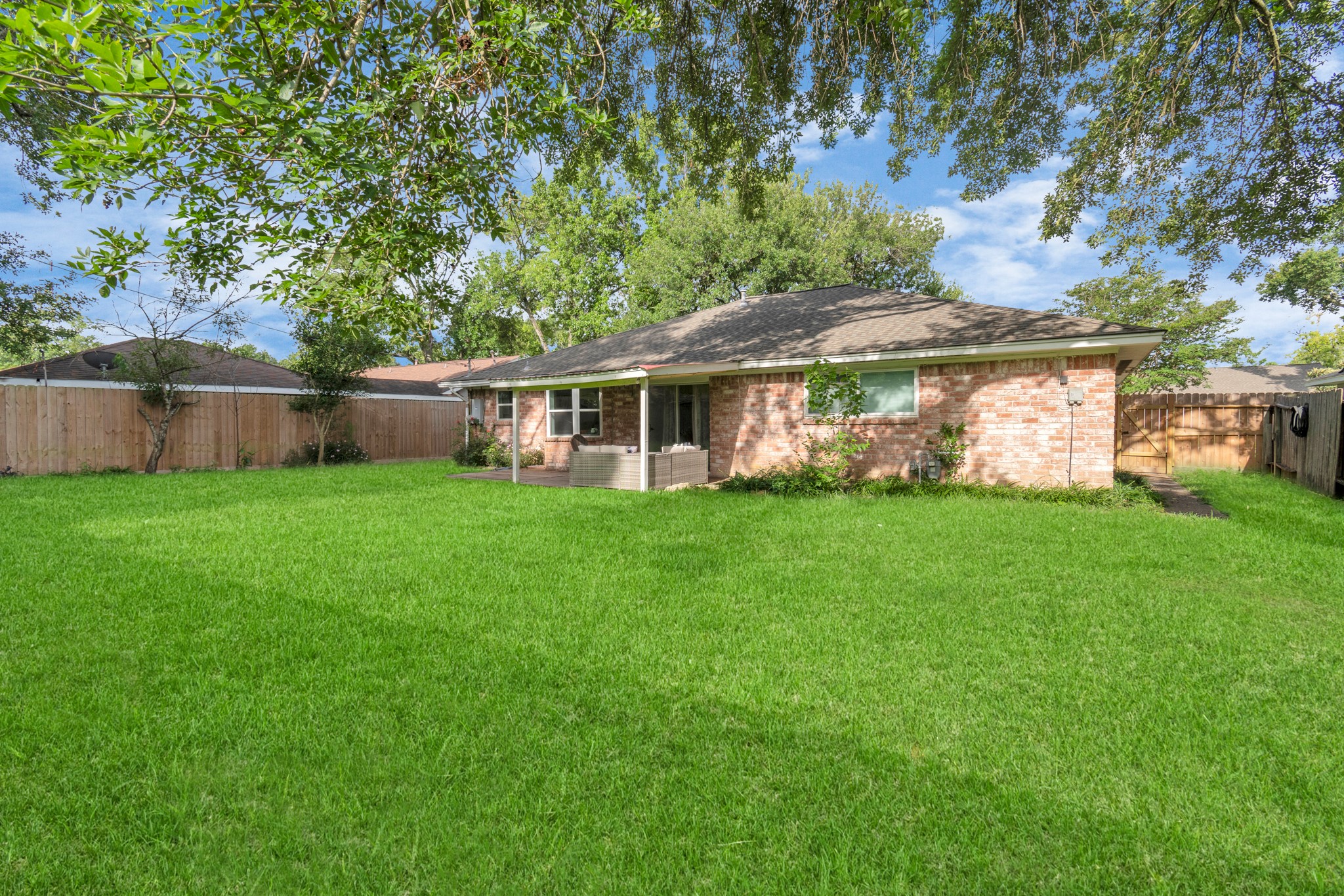 2718 Lazy Spring Drive Houston, TX 77080 - Photo 30 of 32 Spacious backyard with a full fence and established trees. Great space for pets, outdoor gatherings, or quiet evenings outside.
