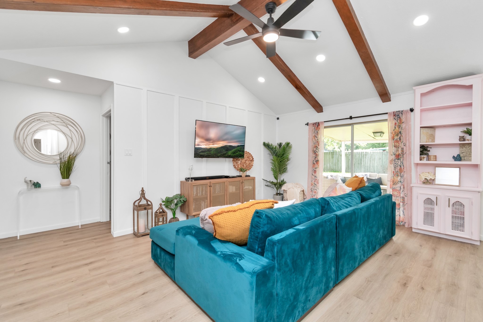 2718 Lazy Spring Drive Houston, TX 77080 - Photo 7 of 32 Bright living room with high ceilings and wood beams. Sliding glass door brings in natural light and leads to the backyard.