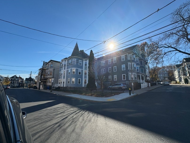 91-93 Calumet Street Boston, MA 02120 - Photo 2 of 9 a street view with large trees