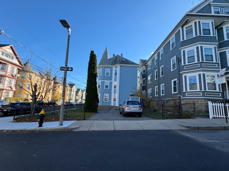 91-93 Calumet Street Boston, MA 02120 - Photo 3 of 9 a city street lined with tall buildings