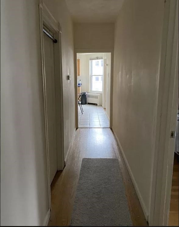 91-93 Calumet Street Boston, MA 02120 - Photo 8 of 9 a hallway with wooden floor windows and a bathroom