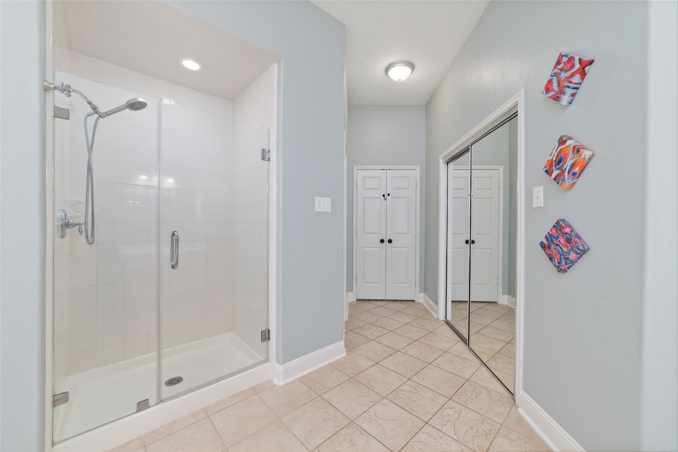 24203 Moon Ridge Court Katy, TX 77494 - Photo 29 of 43 The primary bathroom includes includes a mirrored closet that is very spacious.