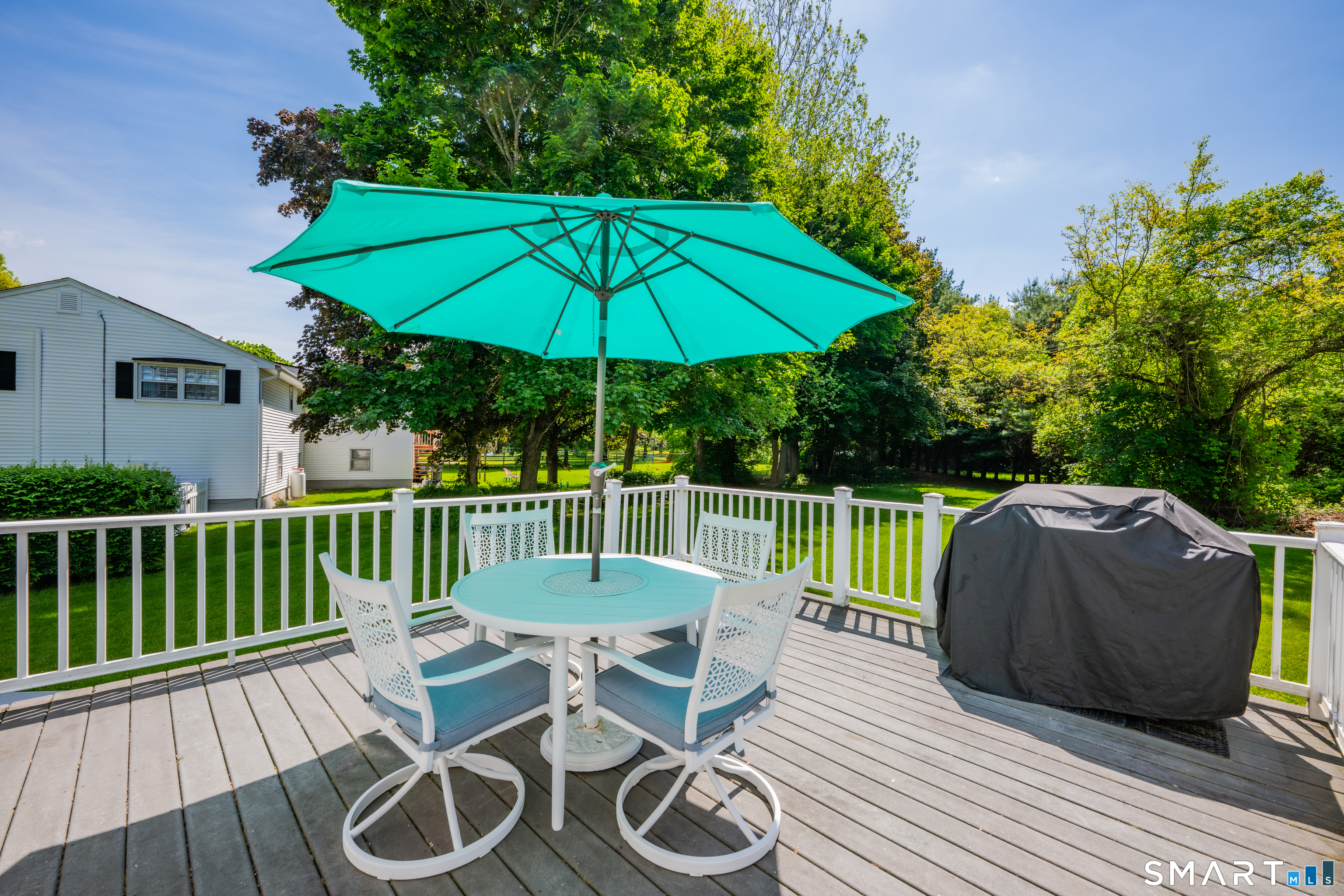 89 Windsorville Road South Windsor, CT 06074 - Photo 19 of 23 a view of a chair and table on the deck