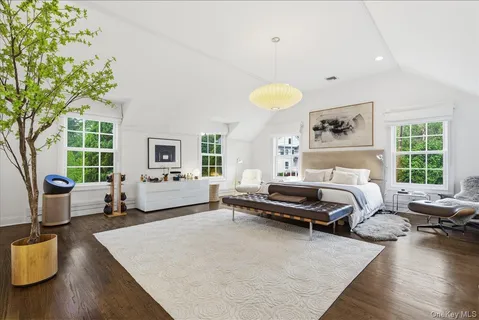 a bedroom with furniture and a window