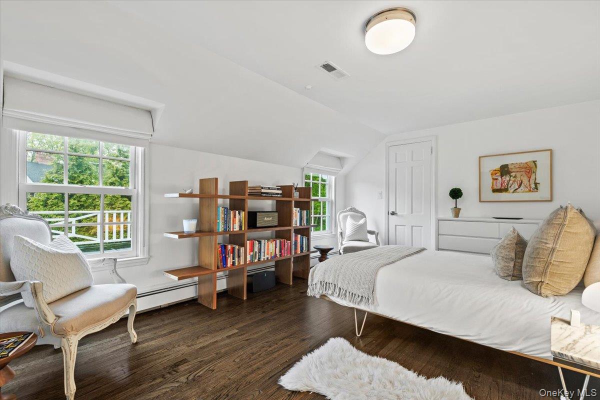 4 Martin Road Rye, NY 10580 - Photo 16 of 28 a bedroom with a bed and wooden floor