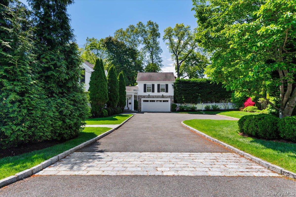 4 Martin Road Rye, NY 10580 - Photo 23 of 28 a view of a house with a yard and a patio