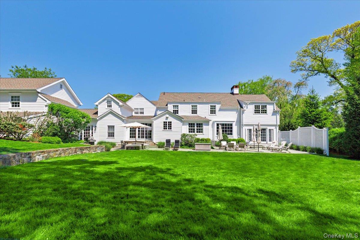 4 Martin Road Rye, NY 10580 - Photo 24 of 28 a front view of a house with a garden