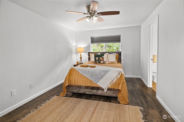 a bath tub sitting next to a white sink
