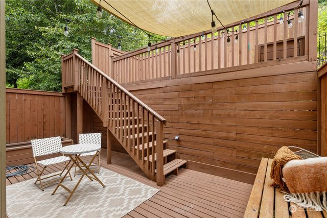 a view of a two chairs in the balcony