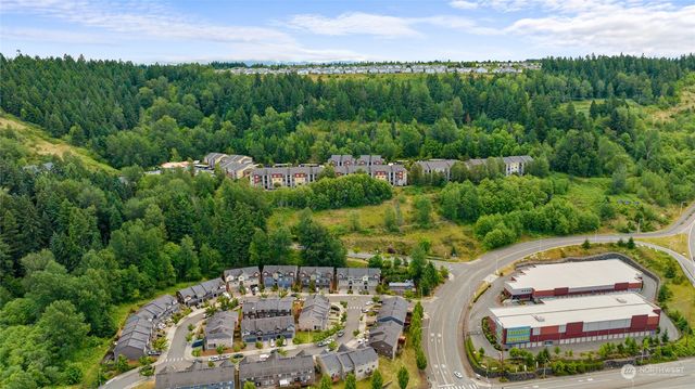 a front view of a house with parking space