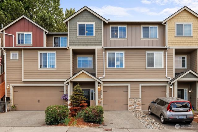 an aerial view of a house with outdoor space and garden