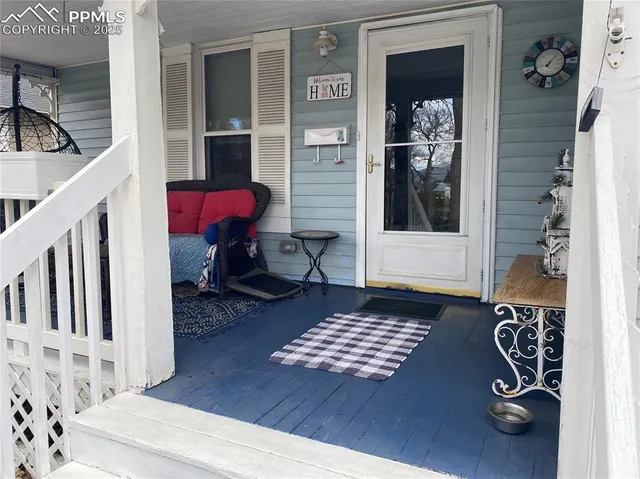 a view of an entryway with wooden floor