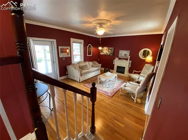 a view of living room with furniture and chandelier