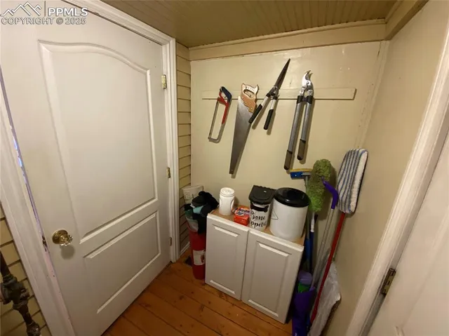 a view of walk in closet with clothes and water camper