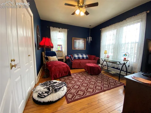 a bedroom with furniture and a window