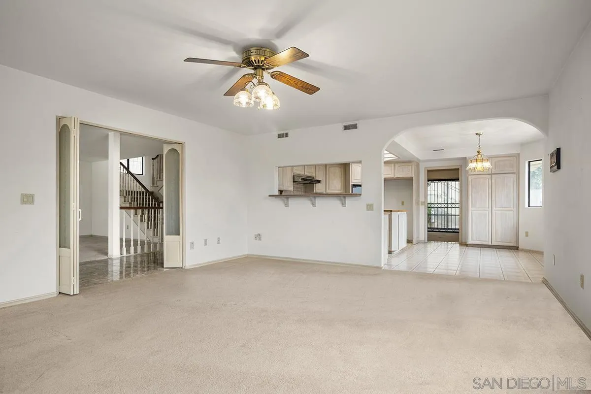 3130 Goldfinch Street San Diego, CA 92103 - Photo 16 of 59 a view of empty room with wooden floor and ceiling fan