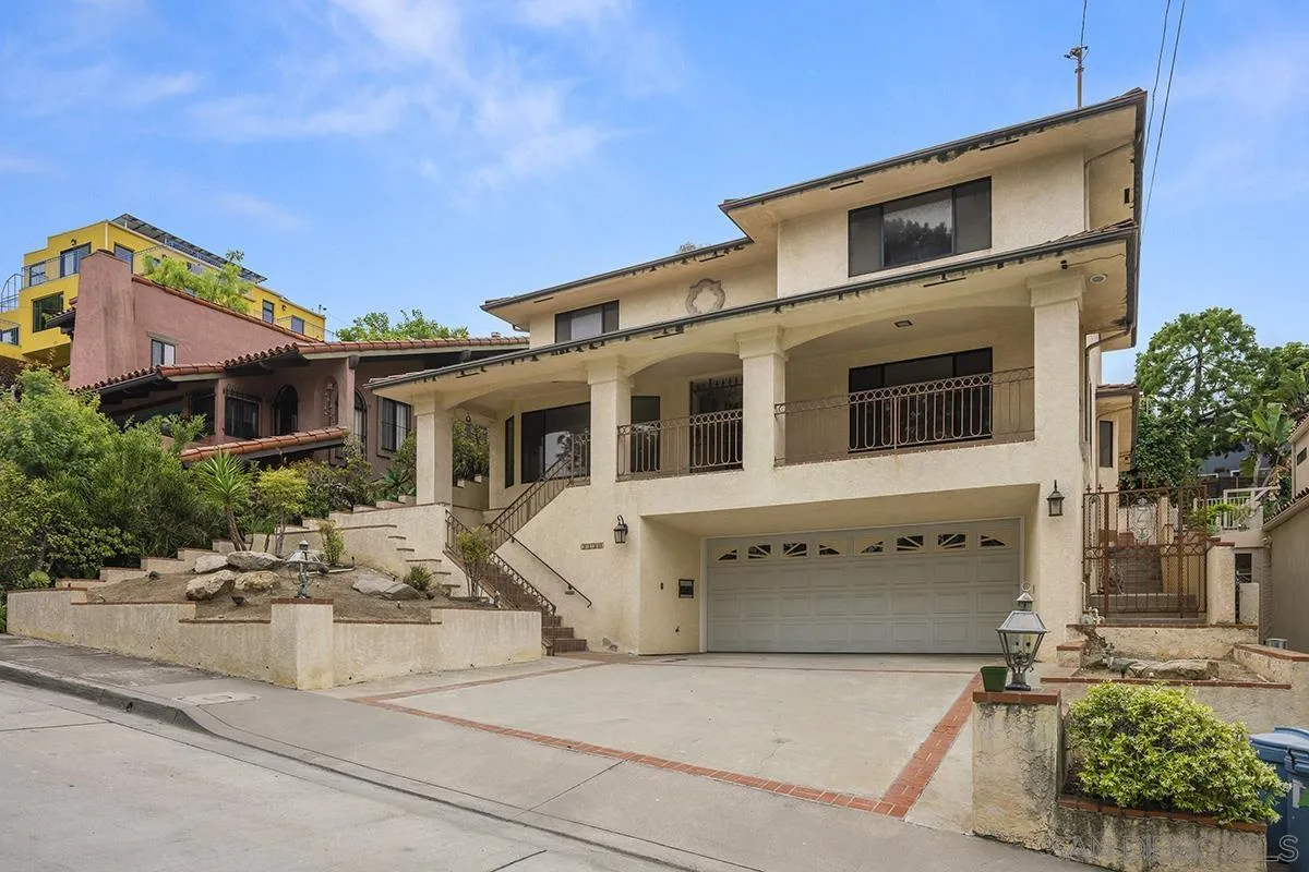 3130 Goldfinch Street San Diego, CA 92103 - Photo 2 of 59 a front view of a house with a yard
