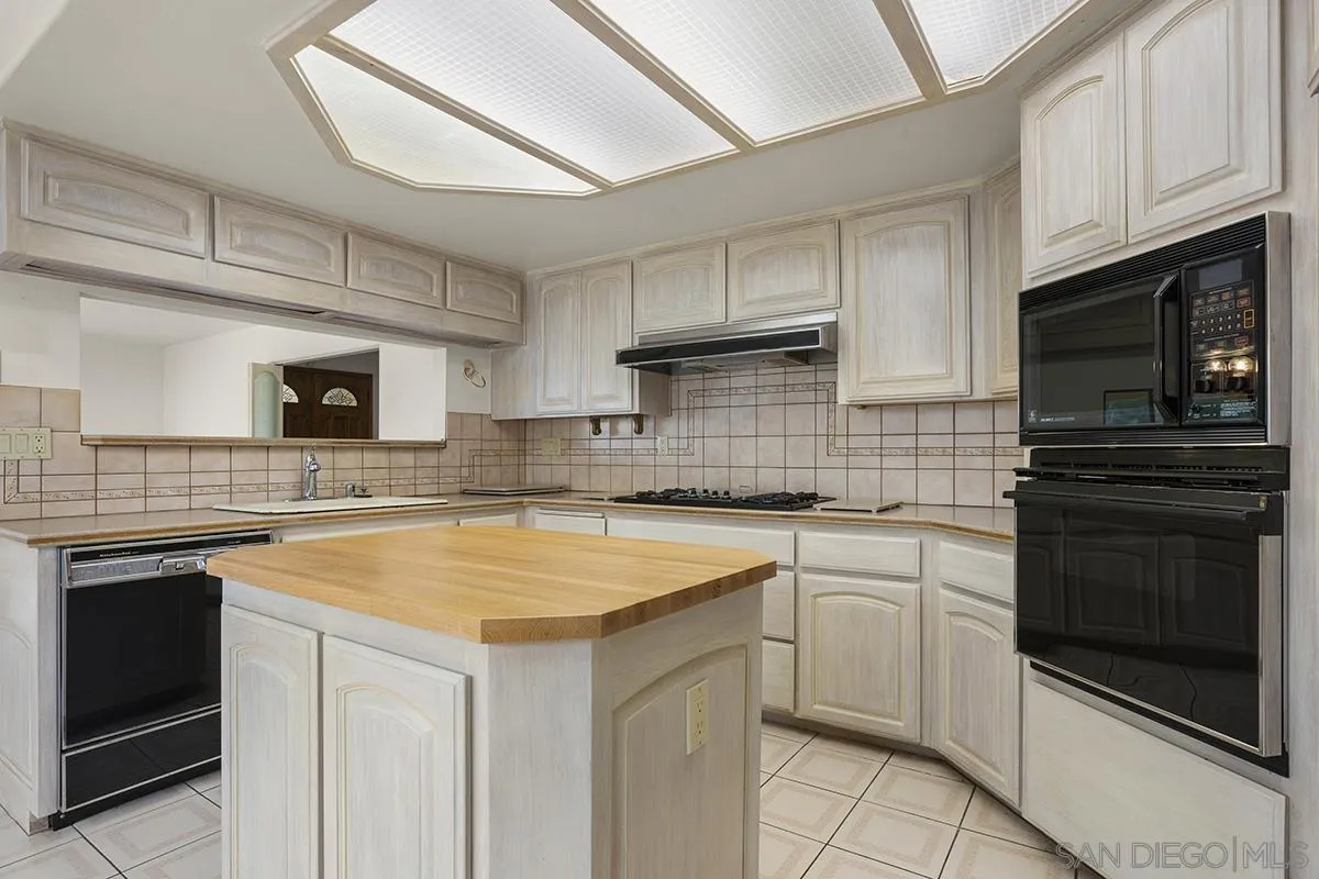 3130 Goldfinch Street San Diego, CA 92103 - Photo 23 of 59 a kitchen with cabinets appliances and a sink